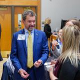 CU President Todd Saliman speaks with leaders at a quantum workforce development event