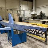 A concrete canoe in the shape of a blue shark.