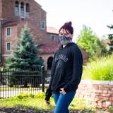 student wearing mask on campus