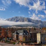 CU Boulder campus with fog and Flatirons in background