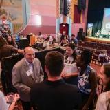 CU Boulder Chancellor Phil DiStefano, left, greets guests and students at the CU Night in Downtown Boulder event at Boulder Theater