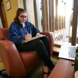 Student studying in a CU dormitory lounge