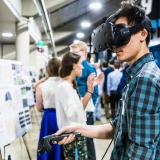 Person using VR headset at CU Engineering Projects Expo