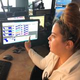 A CU Boulder police dispatcher is seen working with the upgraded communications system