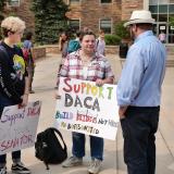 People hold DACA support signs at CU Boulder