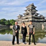 Danielle Salaz of the Center for Asian Studies with a business leader and student in Japan