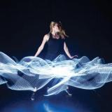 A performer dancing with lights