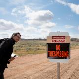 Eric Lipton looks at 'No Trespassing' sign