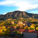 CU Boulder campus during fall with Flatirons in background