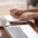 Person learning while sitting at a laptop