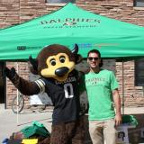 Chip the Buffalo with a Green Stampede volunteer