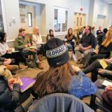 Campus community members sit in circle at Diversity and Inclusion Summit session