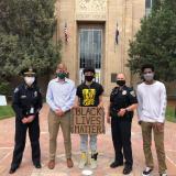 CU Police Chief Doreen Jokerst and other area law enforcement officials take a photo with students during Black Lives Matter march