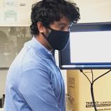 Assistant Professor Kaushik Jayaram works in the lab while wearing a mask