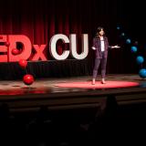 TEDxCU speaker on stage