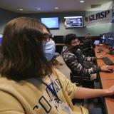 CU Boulder undergraduate students, left to right, Adrian Bryant and Rithik Gangopadhyay work in the mission operations center for IXPE. 