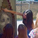 Jasmine Baetz talks to CU Science Discovery campers about one of the mosaic portraits. (Photo by Lisa Schwartz, CU Boulder)