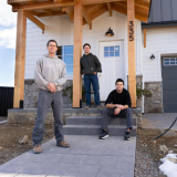 Matt Morris, George Kurtz and Daniel Donado Quintero stand in front of Morris's new home