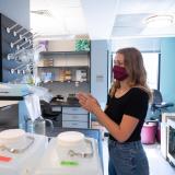 researcher works in lab on campus