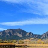A wide image of the CU Boulder South property with the Flatirons in the background