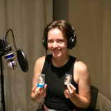 Mikayla Huffman in the studio with D&D figurines