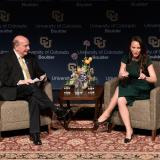 Molly Bloom interviews on stage with CU Boulder Chancellor Philip DiStefano at Macky Auditorium (Kira Vos)