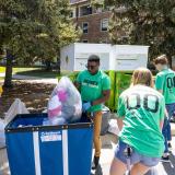 Volunteers helping students move out of residence halls.