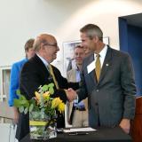 CU Boulder Chancellor Philip DiStefano and Lockheed Martin CTO Keoki Jackson shake hands