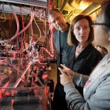 Henry Kapteyn and Margaret Murnane talk to graduate student Qing Li in their lab at JILA