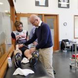 Inigo San Milan treating a cyclist with his glycogen testing invention.