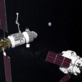 Illustration of NASA's planned Orion Spacecraft (right) docking at the Lunar Gateway (left).