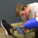 Student Max Armstrong, a finalist in last year's competition, works with affordable prosthetic