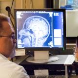 researchers using an MRI scanner