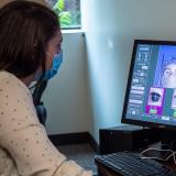 Graduate student Megan Caruso monitors data from an eye-tracking program that can follow a subject's attention as they learn or
