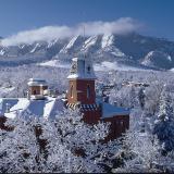 Old Main and Flatirons covered in snow