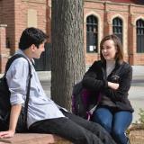 Two students talk on campus
