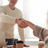 two people shaking hands during interview