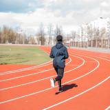 young person running on a track