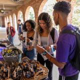 Students stop by the I Love Mondays booth to grab popcorn at pretzels 