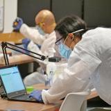 researchers working in a lab