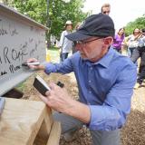 Provost Russ Moore signing Ramaley beam