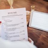 Person holding printed resume