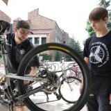 Two students tune up a bike at the UMC Bike Station