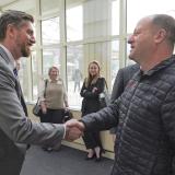 Daniel Salvetti greets Colorado Governor Jared Polis
