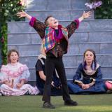 Children perform Shakespeare on stage