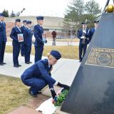 Air Force ROTC cadet leaves rose at shuttle memorial