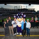 CU Boulder first-place international solar decathlon team members pose with U.S. Secretary of Energy Jennifer Granholm, second from right, and Colorado Rockies mascot Dinger during a game against the St. Louis Cardinals on July 1. The team was hosted and recognized by the secretary during her visit to Denver. (Photo courtesy of the Colorado Rockies)