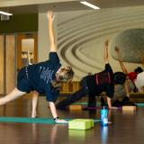 students participating in a yoga class on campus