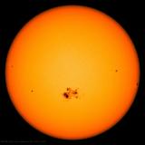 Sunspots appear on the surface of Earth's sun.