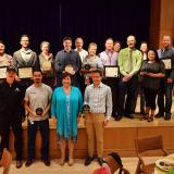 The campus sustainability award winners stand shoulder to shoulder.